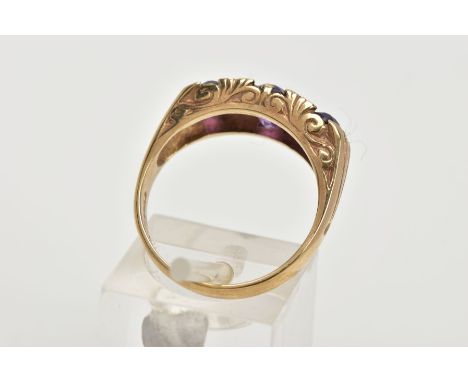 A MODERN 9CT GOLD SEVEN STONE DRESS RING, designed with three oval cut amethyst's, interspaced with four small single cut dia