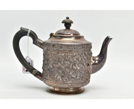 A LATE VICTORIAN SILVER TEAPOT, embossed floral and foliate design, fitted with an ebonised wooden handle and finial, rubbed 