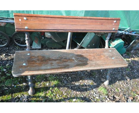 A CAST IRON GARDEN BENCH, tree trunk style bench ends, with replacement slats and bolts, length 131cm