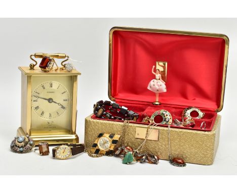 A JEWELLERY BOX WITH CONTENTS, gold tone jewellery box with a variety of silver and white metal jewellery such as a white met