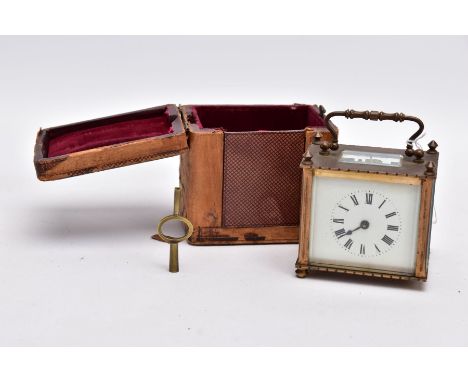 A SMALL LEATHER CASED BRASS TRAVEL CARRIAGE CLOCK, glass panels, white dial with roman numerals, mechanical key wound movemen