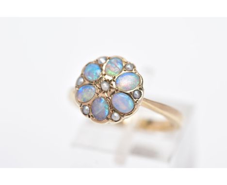 A MODERN 9CT GOLD OPAL AND SPLIT PEARL CLUSTER RING, designed with oval cabochon opals and split pearls, tapered shoulders, h