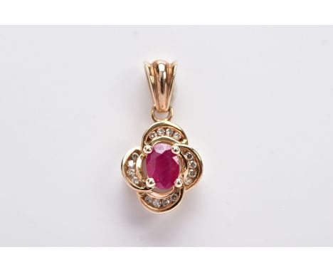 A 9CT GOLD RUBY AND DIAMOND PENDANT, centring on an oval cut ruby (possibly treated/synthetic), within four curved, round bri