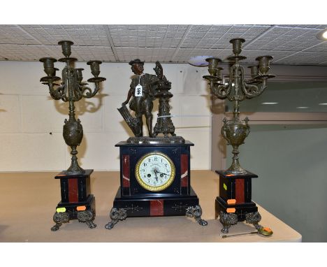 A LATE 19TH CENTURY BLACK SLATE, MARBLE AND BRONZED CLOCK GARNITURE, the clock with figural surmount of a man standing beside