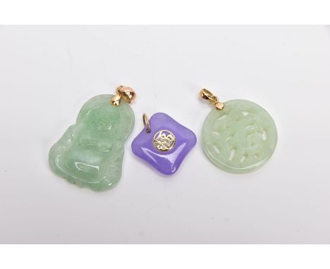 THREE JADE PENDANTS, the first a carved Buddha, fitted with a tapered bail, stamped '14k', the second a carved openwork symbo