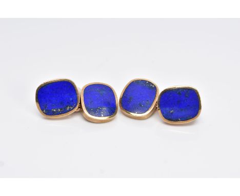 A PAIR OF 9CT GOLD, LAPIS LAZULI CUFFLINKS, each designed with two rub over set lapis lazuli set panels, interspaced with a c