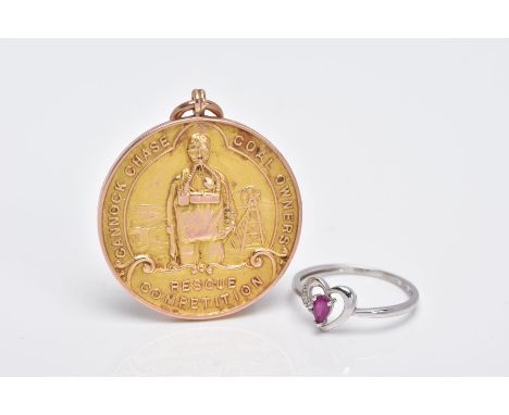 A 9CT GOLD MOUNTED MEDAL AND A 9CT WHITE GOLD RUBY AND DIAMOND RING, the medal of a circular form, inscribed 'Cannock Chase c