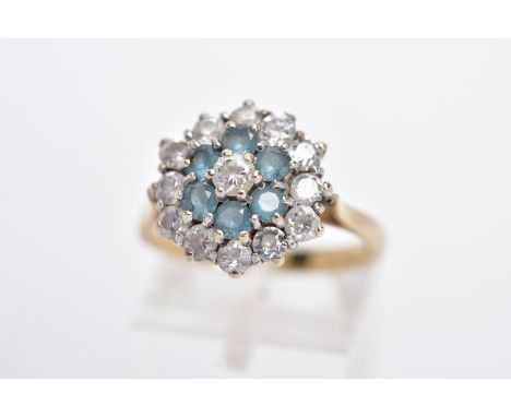 A 9CT GOLD DRESS RING, tiered cluster set with circular cut colourless stones assessed as paste, with cluster cut blue stone 