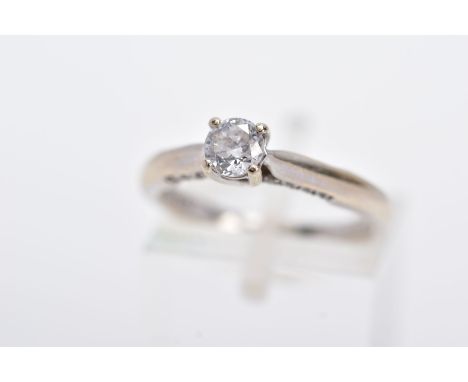 AN 18CT WHITE GOLD DIAMOND RING, designed with a central claw set, round brilliant cut diamond, tapered shoulders, single cut