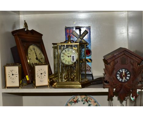 SIX CLOCKS COMPRISING A GERMAN ANNUAL ANNIVERSARY CLOCK, two Rapport of London carriage clocks, cuckoo clock, German Schnecke