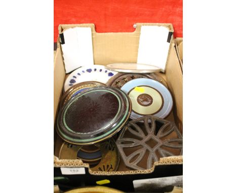 A TRAY OF CAST METAL AND CERAMIC TEAPOT STANDS