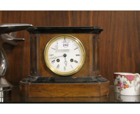 A VINTAGE WALNUT MANTEL CLOCK