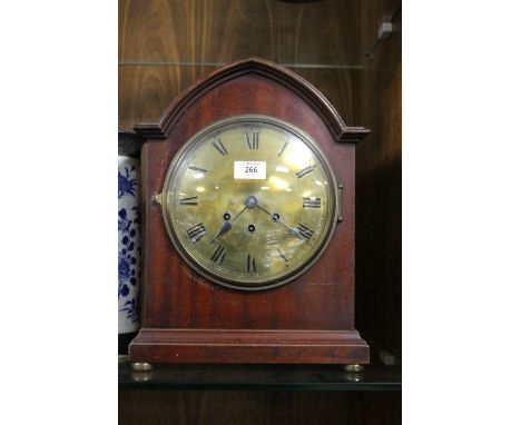 AN EDWARDIAN MAHOGANY ARCHED MANTEL CLOCK WITH GUSTAV BECKER MOVEMENT, the brass dial with Roman numerals and Westminster chi