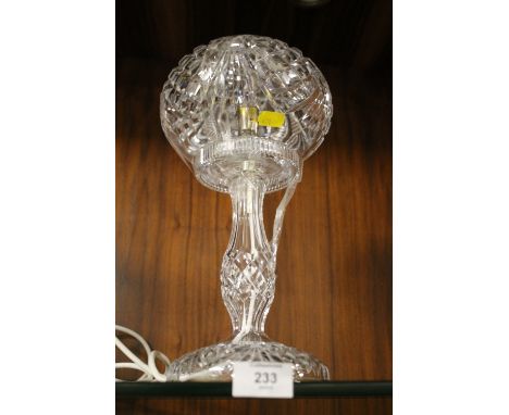 A HEAVILY CUT GLASS TABLE LAMP