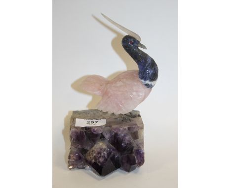 AN AMETHYST AND ROSE QUARTZ FIGURE OF A BIRD