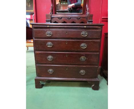 A George III mahogany bachelor's chest of small proportions, the brushing slide over four graduating long drawers on bracket 