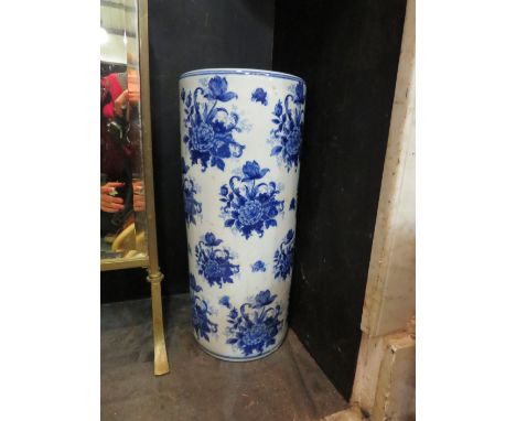 A cylindrical blue and white vase/stick stand with floral decoration, 45cm tall