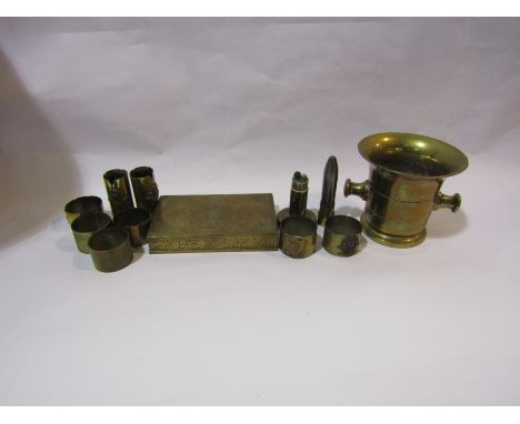 A selection of mainly Trench Art including gun shell lighter, Arras and Bullecourt crested napkin rings, also an engraved bra