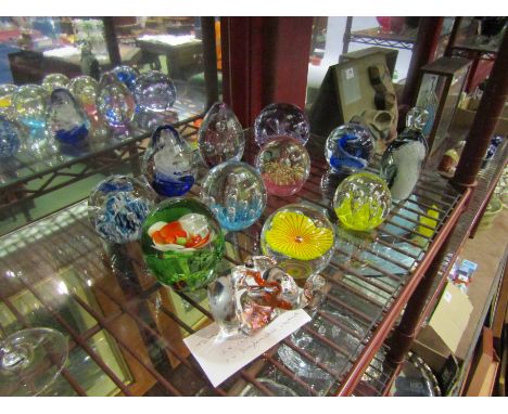 Twelve glass paperweights including Langham elephant and two Caithness examples