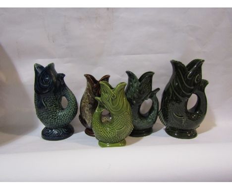 Five ceramic fish glug jugs