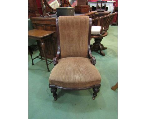 A mahogany slipper chair the scroll backrest on reeded scroll arms over turned and carved melon fluted legs with ceramic cast