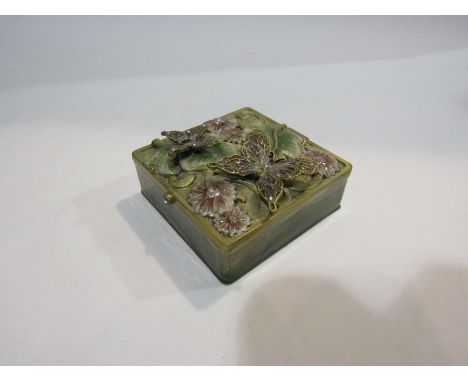 An ornate metal trinket box applied with leaves and butterflies    