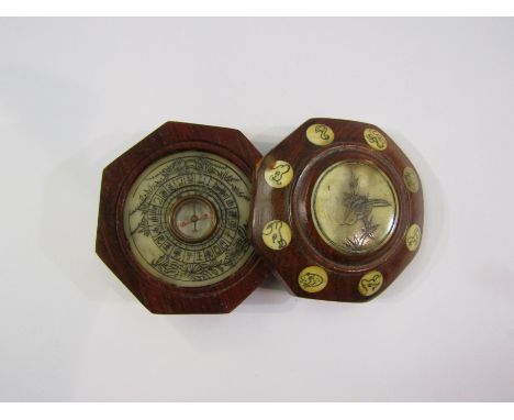 A Chinese Feng Shui hardwood calendar and compass