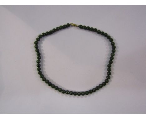 A single strand dark jade bead necklace