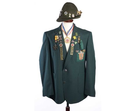 A CONTEMPORARY KENT ARCHERY ASSOCIATION JACKET AND HAT the fabric of green cloth, numerous pins on the lapel primarily from 1