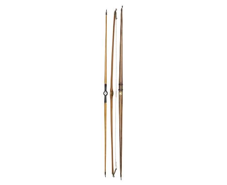 THREE RARE EARLY CENTRE-SHOT BOWS, 19TH CENTURY  the first bow American, by W.H. Wright and G.L. Thorne, made of light wood, 