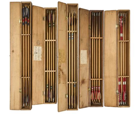 FIVE CASED ARROW SETS, 19TH-20TH CENTURY the first case by Aldred, with twelve arrows painted with green and white banding, 2