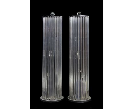 A pair of glass and chromed standard lamps, mid to late 20th century, probably French, each with a ball top above a circular 
