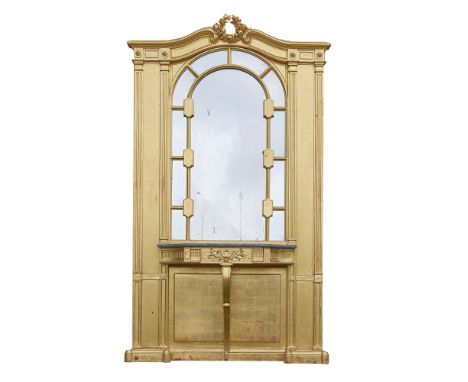 A giltwood hall stand, late 19th century, of architectural form, the arched rectangular back with a laurel wreath to the corn