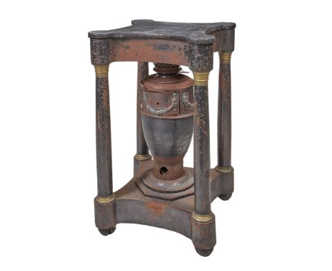 A Louis Philippe tole and marble mounted stove, circa 1830, the shaped fossil marble top above a pierced frieze with a rectan