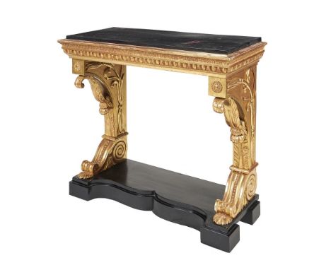 A George IV giltwood and ebonised console table, circa 1825, the top above C-scroll supports and shaped plinth base, 82cm hig