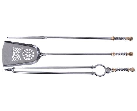 A set of steel and brass mounted fire tools, possibly Scottish, 19th century, comprising shovel, poker and tongs, each with a