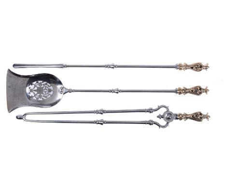 A set of early Victorian steel and brass mounted fire tools, circa 1840, comprising shovel, poker and tongs, with openwork ro