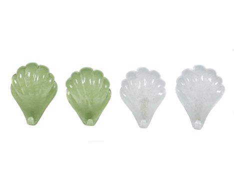 Two pairs of Continental, possibly Italian, moulded glass wall lights modelled as shells, modern, one pair clear, the other g