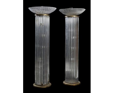 A pair of moulded glass and gilt metal mounted standard lamps in Art Deco taste, mid to late 20th century, probably French, e
