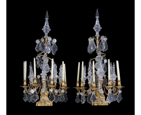 A pair of cut glass and gilt metal six light lustre candelabra in Louis XV taste, late 19th/early 20th century and later, eac
