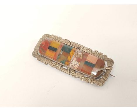 Victorian parquetry Scotch Pebble brooch, rectangular, with engraved silver mount. C1880 72mm x 27mm.