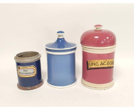 Two 19th century ceramic chemist jars with covers in blue and pink glaze, named to the pink jar, with a smaller blue chemist 