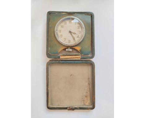 Travelling clock by Benson London, in folding square leather case with gilt monogram "M.K." below a coronet. 