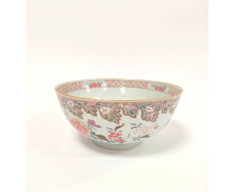 Chinese export 18th century porcelain bowl painted in floral and scroll enamels on circular foot, 10cm high, 23cm diameter.Co