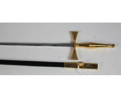 Sword: A gilt brass Masonic dress sword of the Knights Templar. Etched blade 27.5". Maltese Cross, Crossguard. Polished brass