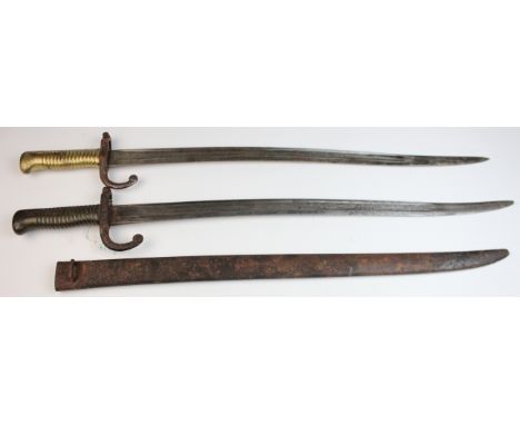 Bayonets: French Model 1866 Sabre bayonets for the Chasspot rifle. 1) Unmarked example, cross guard pitted. No scabbard. 2) S
