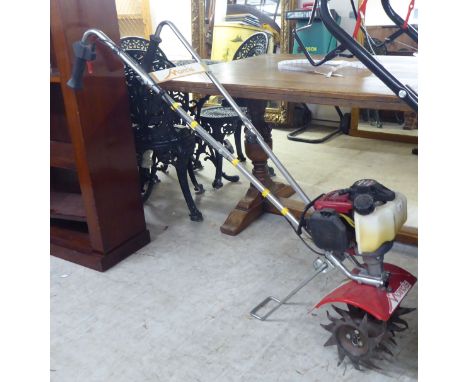 A Mantis Scarifyer with a Honda GX25 petrol engine&nbsp; 