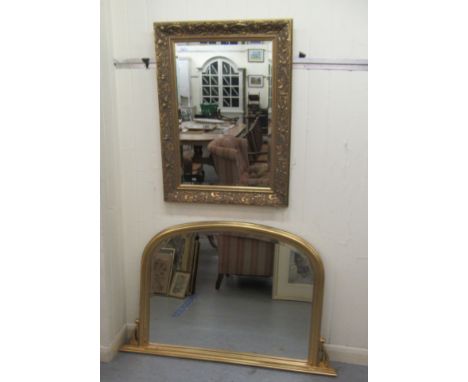 A modern mirror, the bevelled plate set in an Art Nouveau inspired, moulded gilt frame&nbsp; 27" x 37"; and an overmantle mir