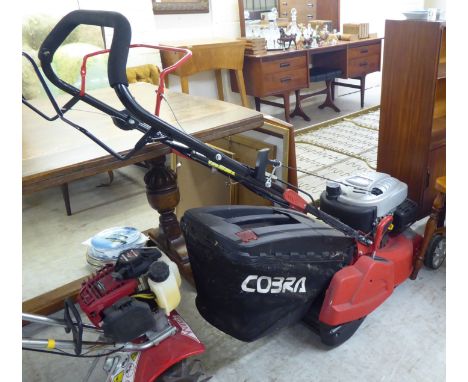 A Honda 135cc petrol driven Cobra lawnmower with a 16"dia rotary cut and a grass box 