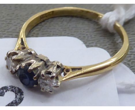 An 18ct gold sapphire and diamond three stone ring&nbsp; 